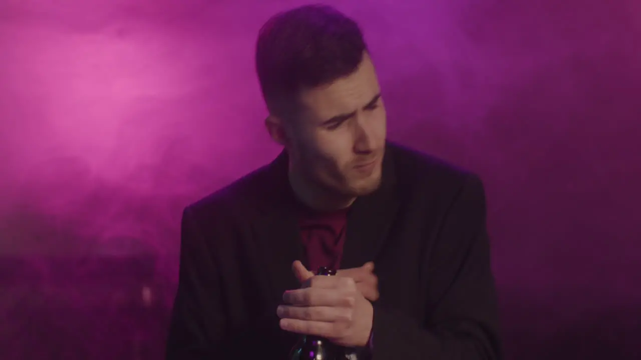 Young Man Drinking Beer And Dancing At Disco 1