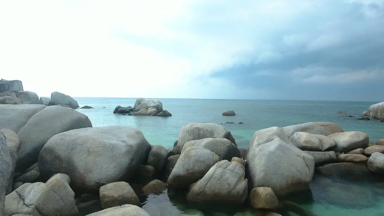 rocky island in the middle of the sea