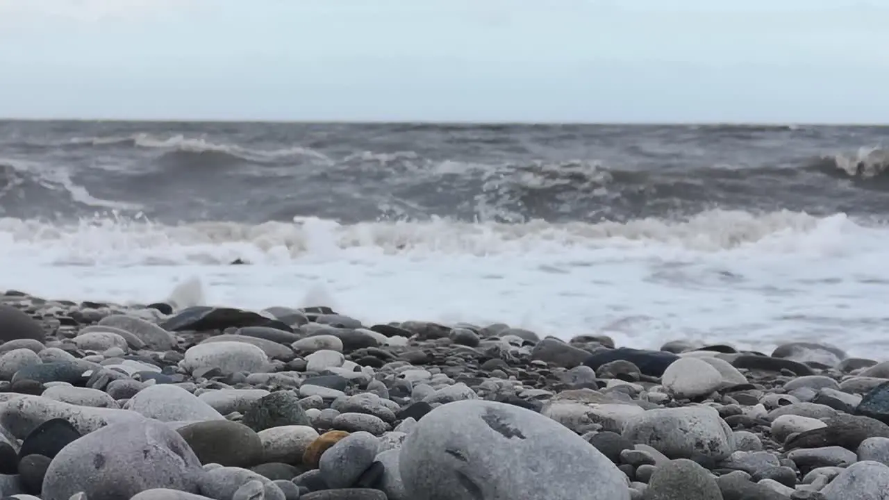 February 2022 storm Franklin dramatic crashing waves on British pebble beach seascape