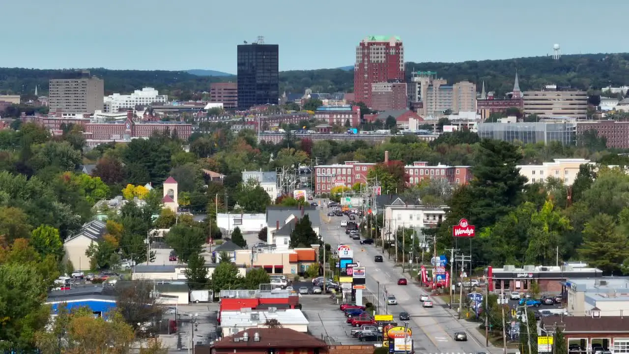 Aerial drone footage of American street populated by fast food restaurants and businesses outside of a small city in the northeast