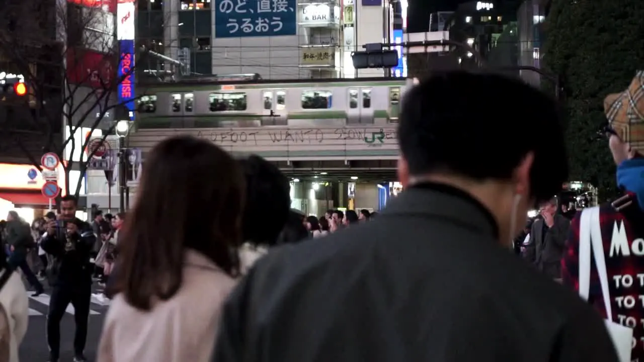 Shibuya Crossing at Night with Train