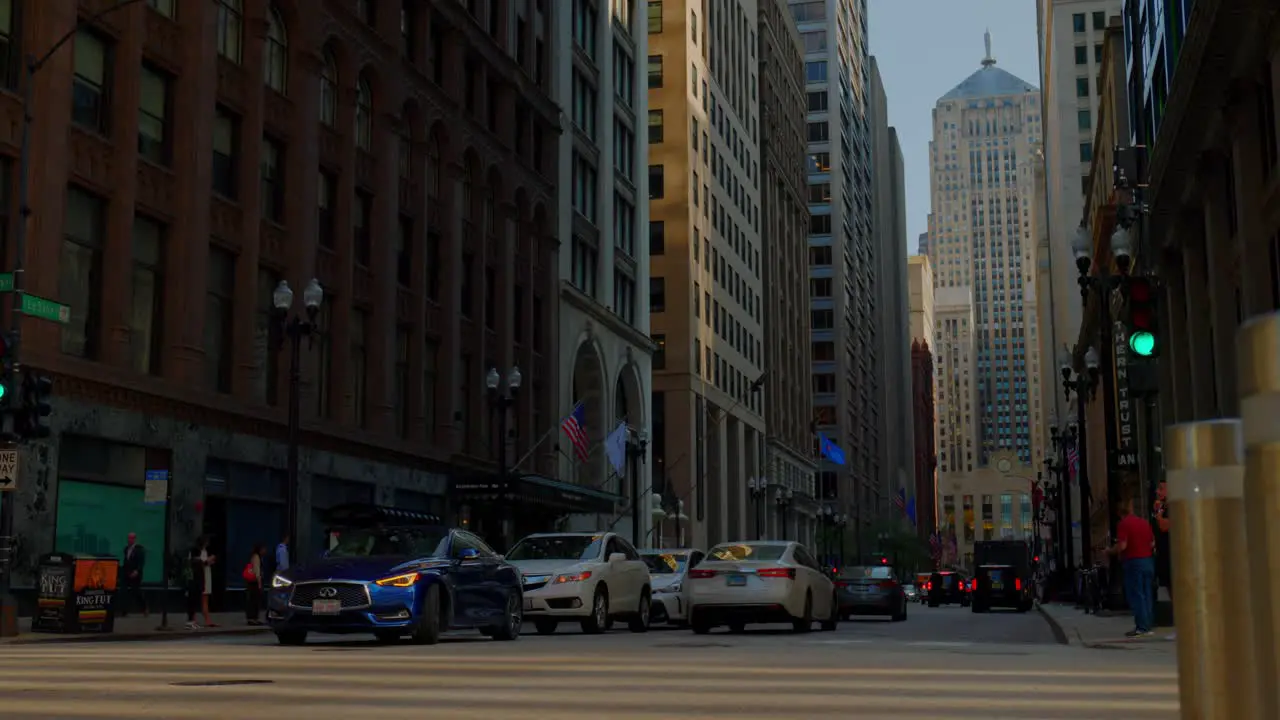 Cars travel through an intersection in downtown Chicago