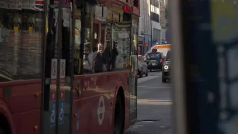 Pan From Bus Stop Map to Passing London Bus