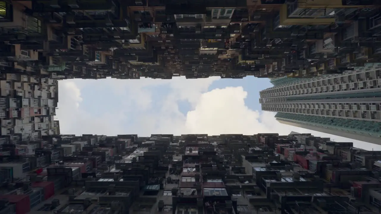 shot from a old Chinese public building from the 60's during the day some clouds are in the sky