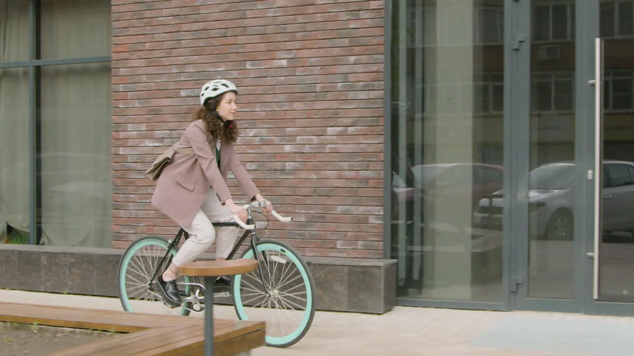 Young Woman In Formal Clothes Going To Work On Bicycle 1