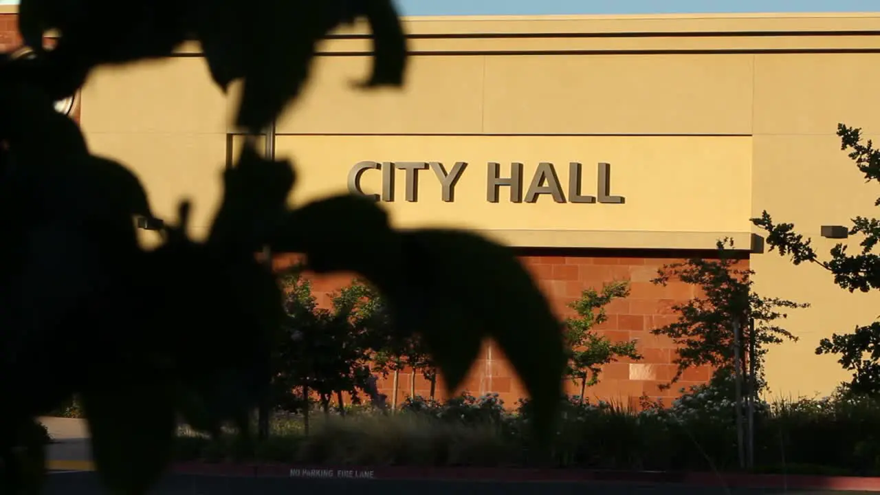 City Hall Anytown USA Wide Establishing Shot Afternoon Tracking Right From Behind Tree