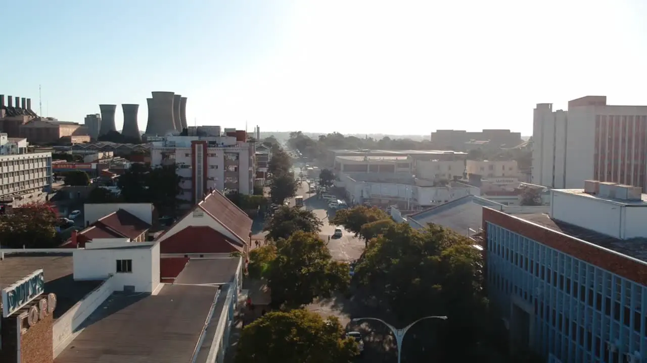 A push up drone shot of a busy city area Bulawayo Zimbabwe at sunset