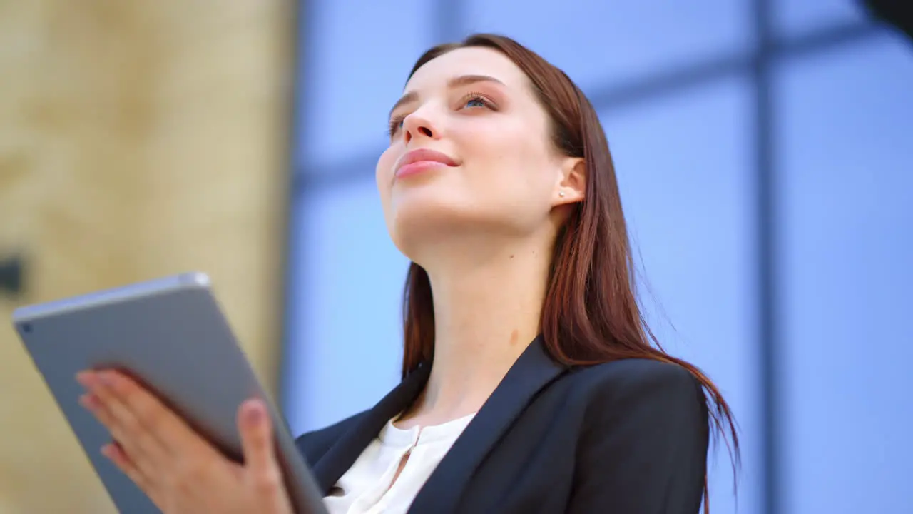 Business woman hands using tablet outdoors Lady using digital device outside