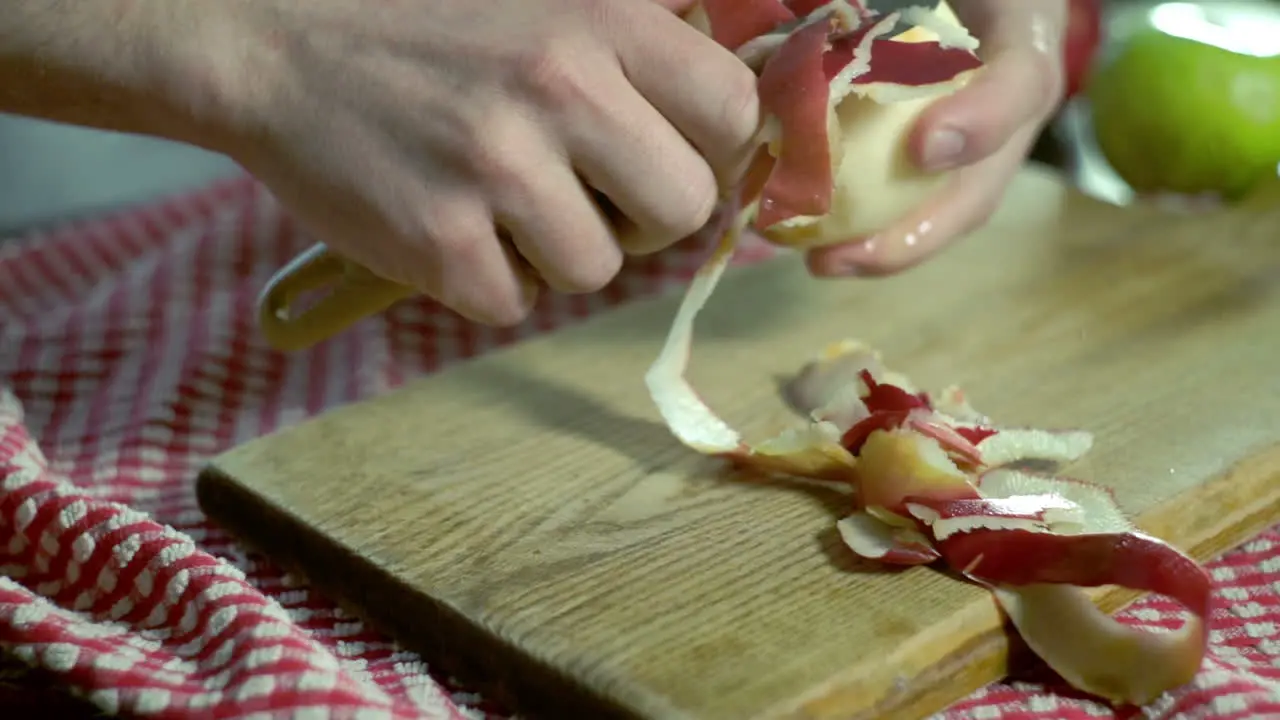 Peeled apple Hands peeling fresh apple Healthy food Vegan breakfast