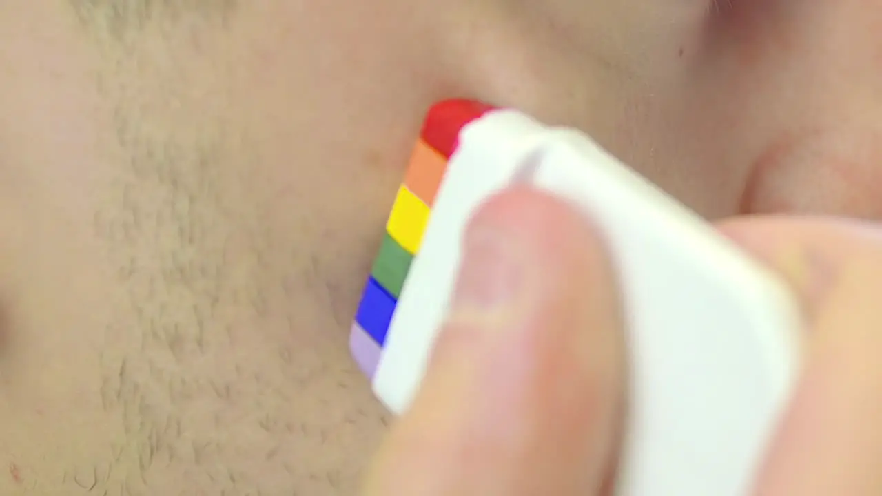 Painting Pride Flag onto Face