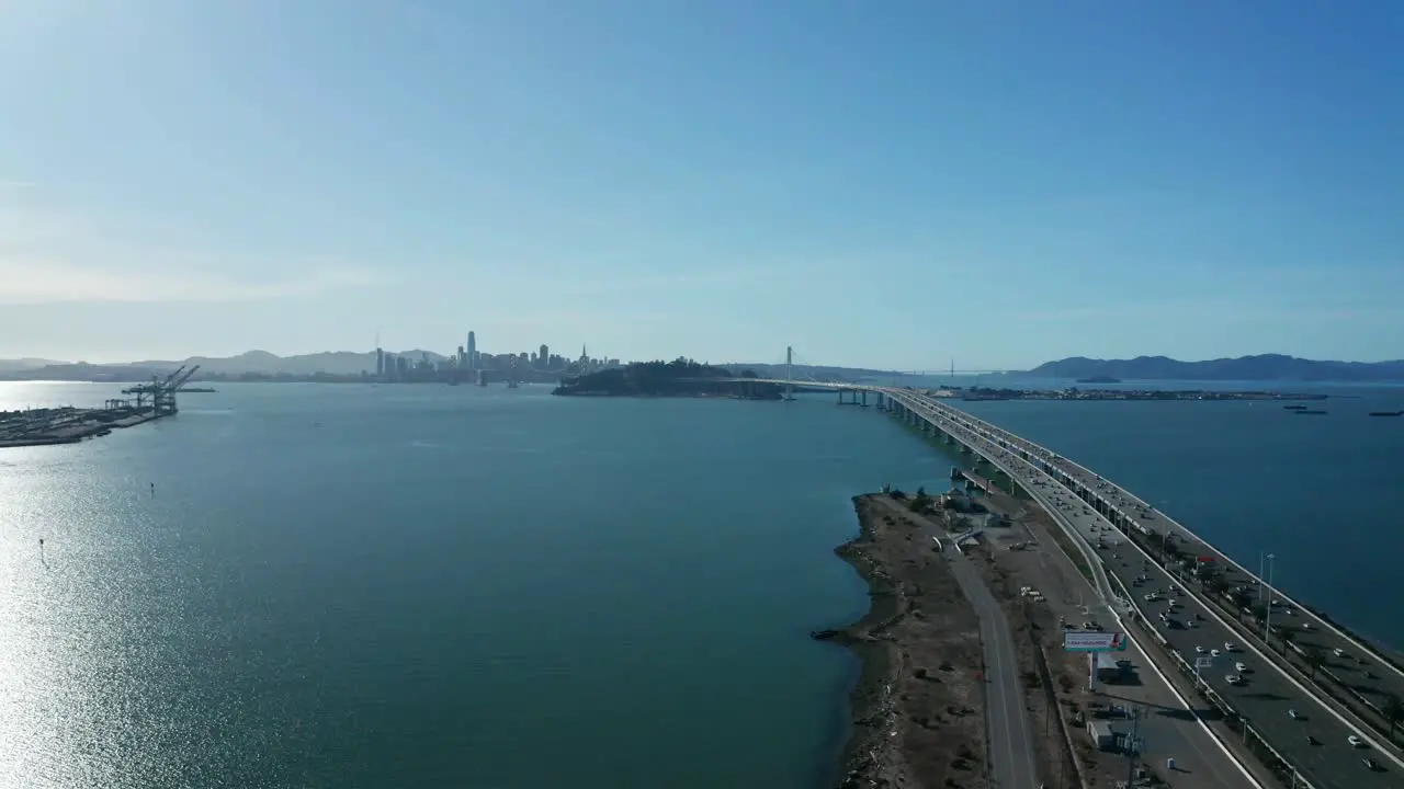 The long bay bridge that spans the shipping estuary and connects the city to the business islands