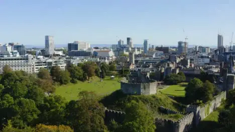 Drone Shot Rising Above Trees Revealing Cardiff Castle 01