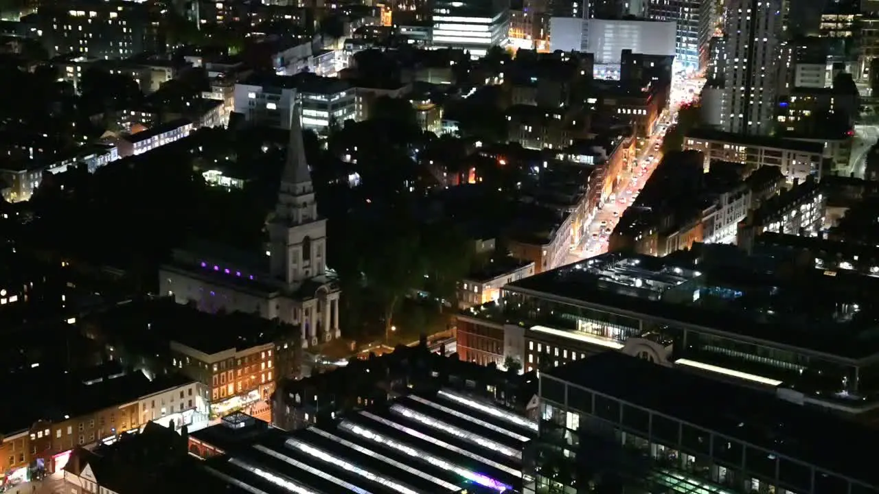 Traffic passing Christ Church Spitalfields in East London United Kingdom