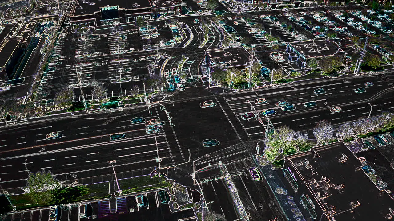 Vehicle traffic at a busy intersection with an artsy x-ray style effect aerial stationary