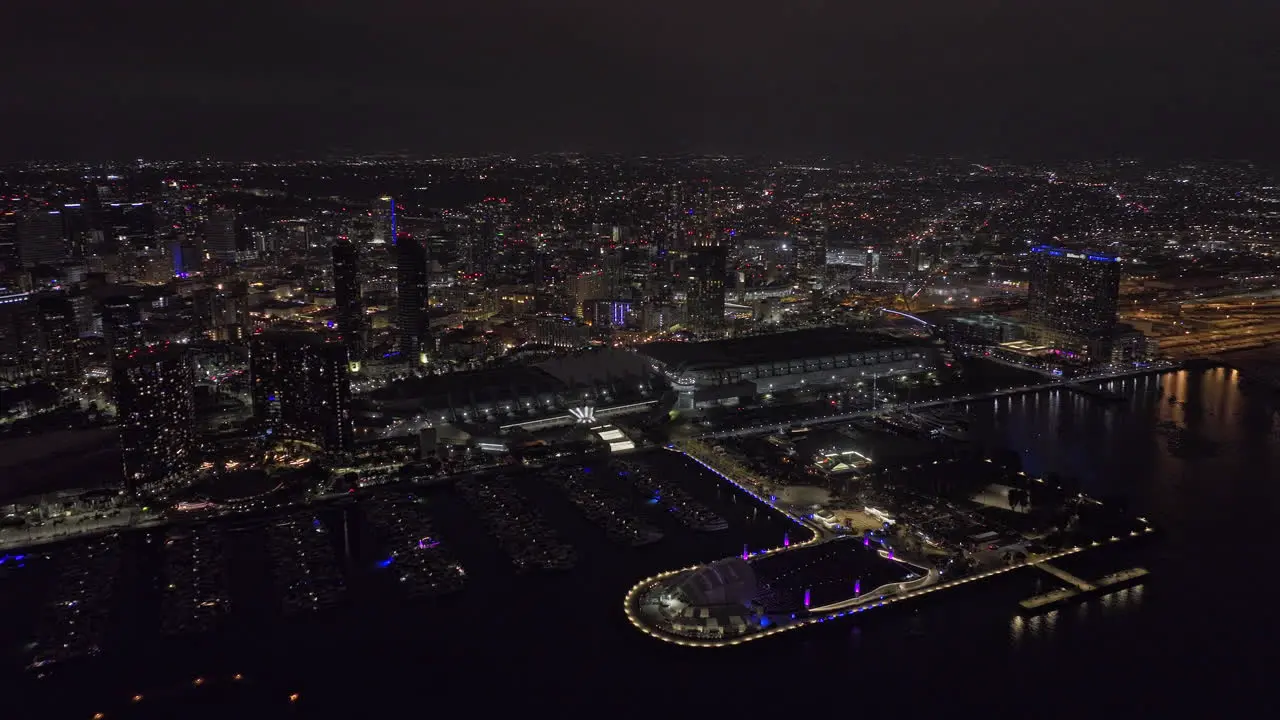 San Diego California Aerial v110 cinematic flyover bay along embarcadero marina park capturing illuminated harbor and bustling downtown cityscape at night Shot with Mavic 3 Cine September 2022