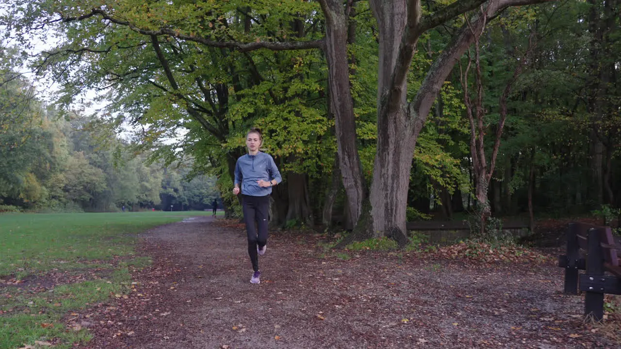 Compelling shot camera moves backward as woman runs towards it