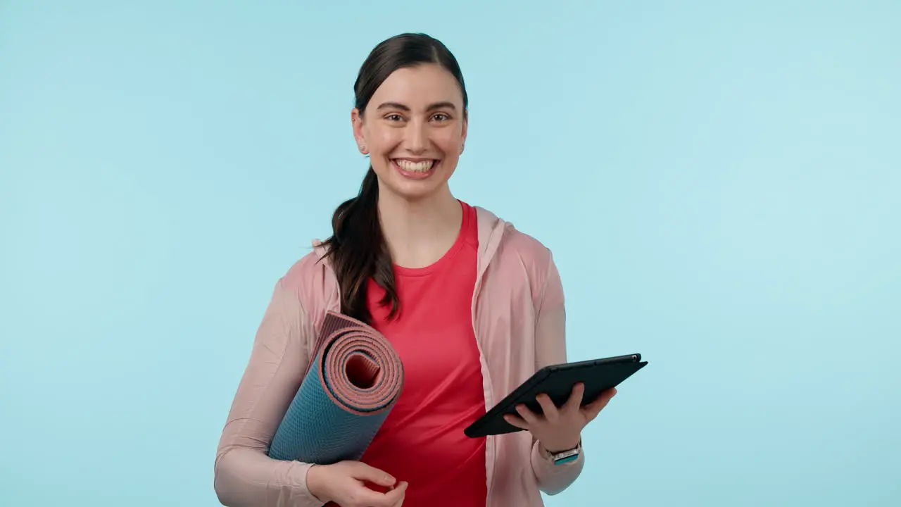 Yoga woman and tablet for workout