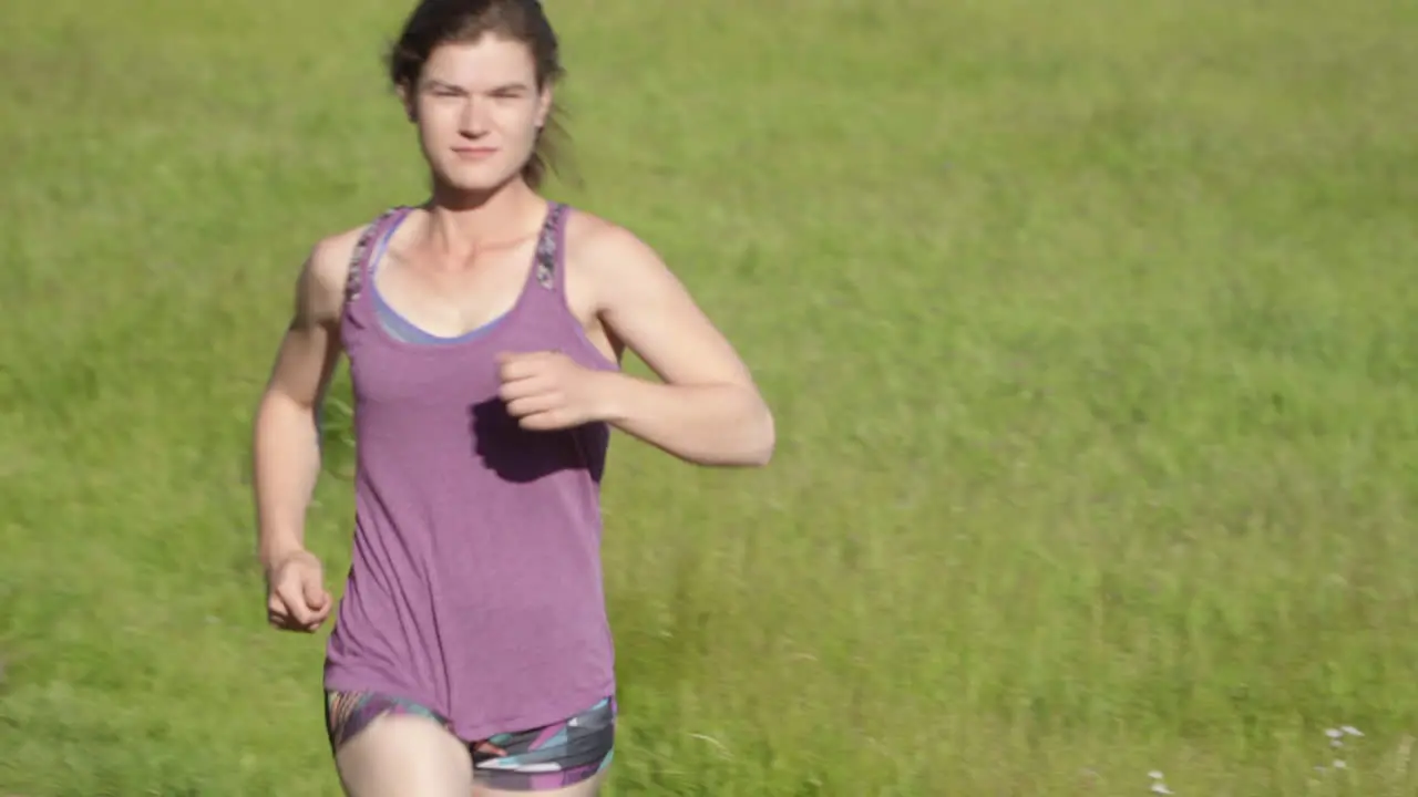 Closeup of Young Woman Running in a Field at Sunset