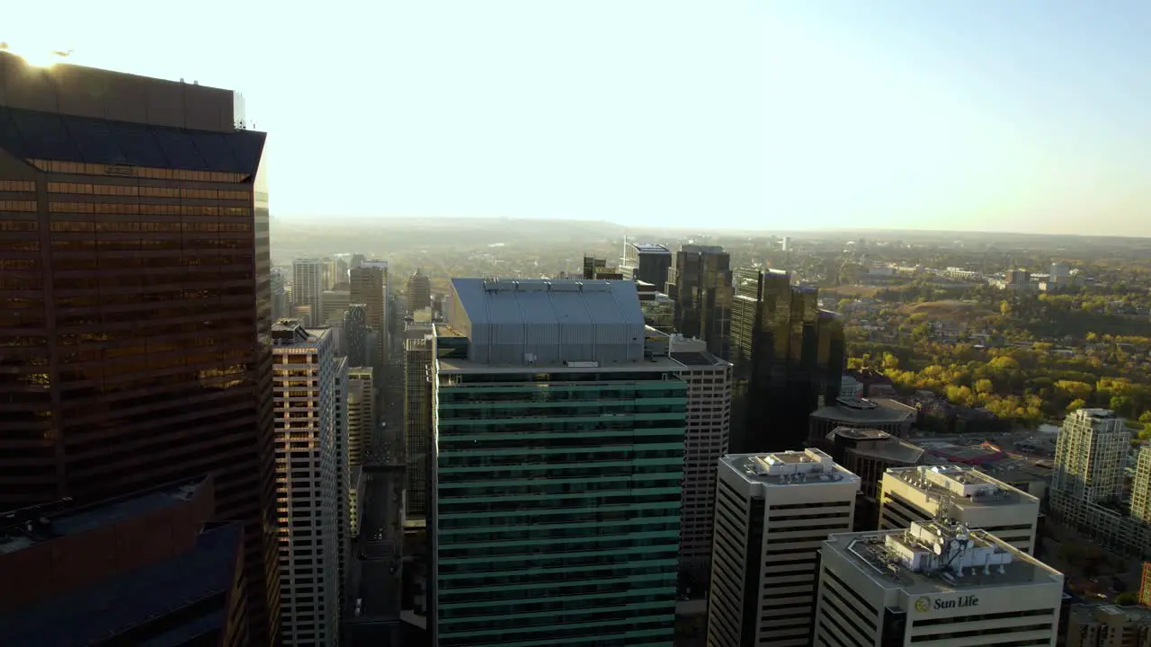 Aerial view in front of the TC Energy Tower in downtown Calgary golden hour in Canada rising drone shot