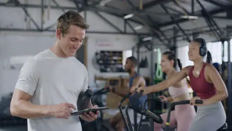 Coach using a digital tablet in a gym