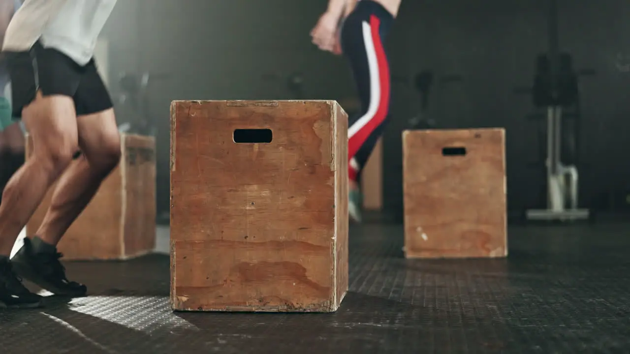 Gym group and box jump for exercise