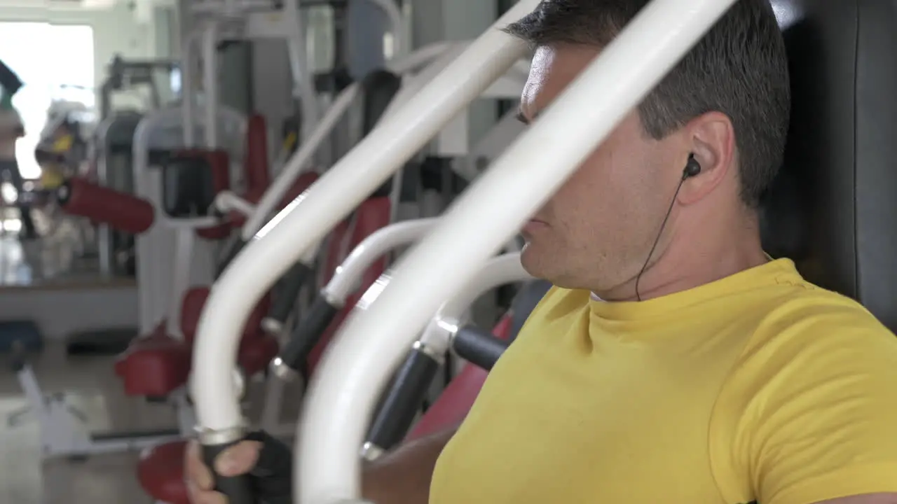 Man finishing set on chest press machine