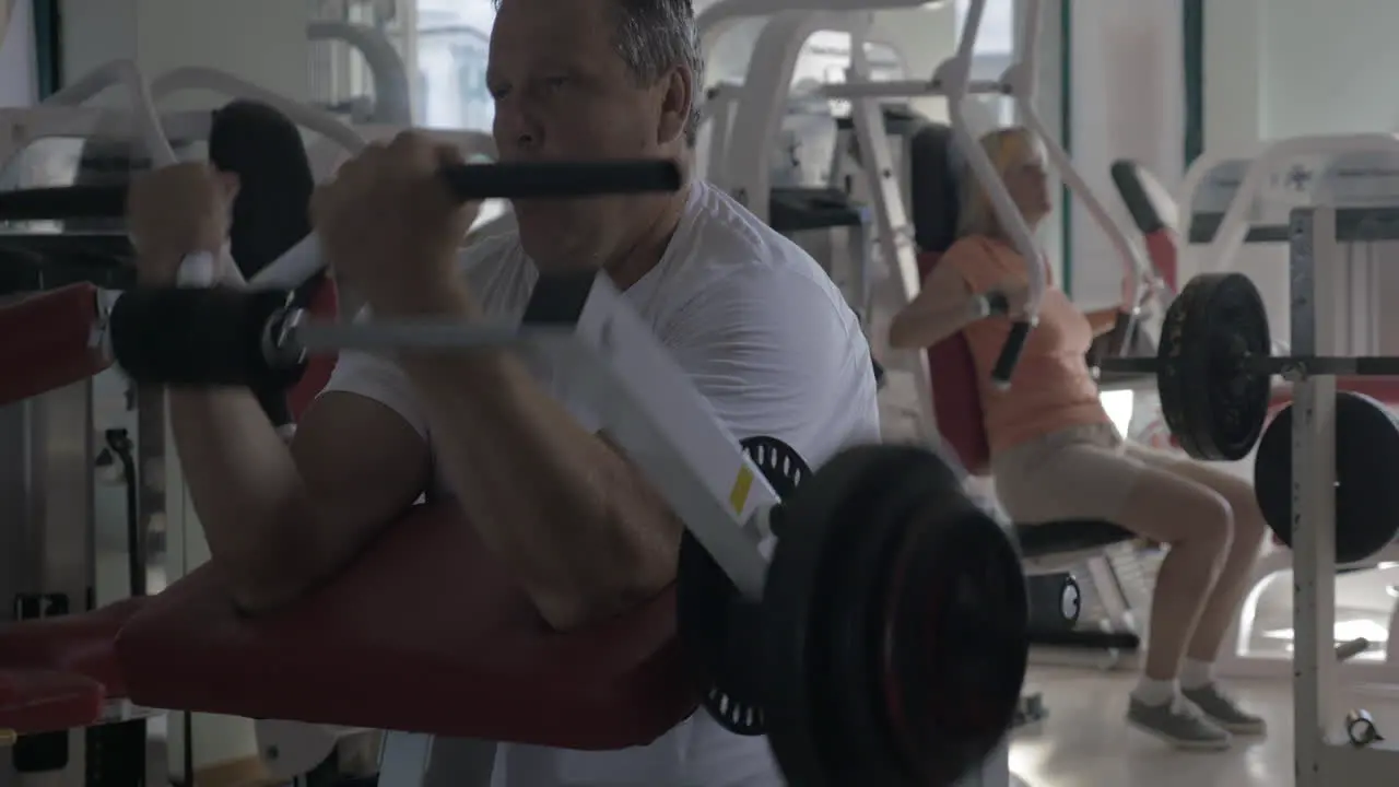 Man working out on biceps in the gym