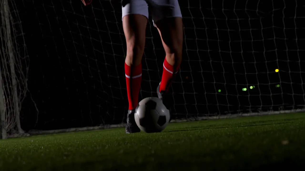 Soccer player dribbling with ball 4k