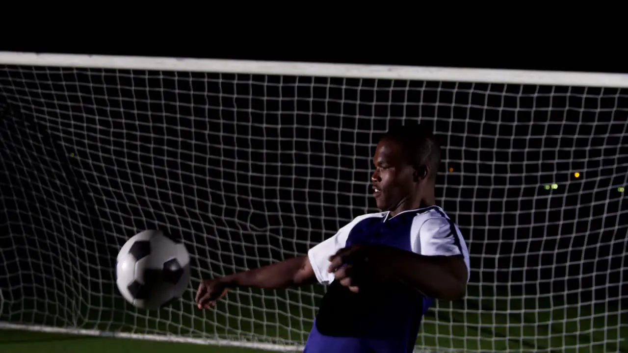 Soccer player controlling ball on his chest 4k