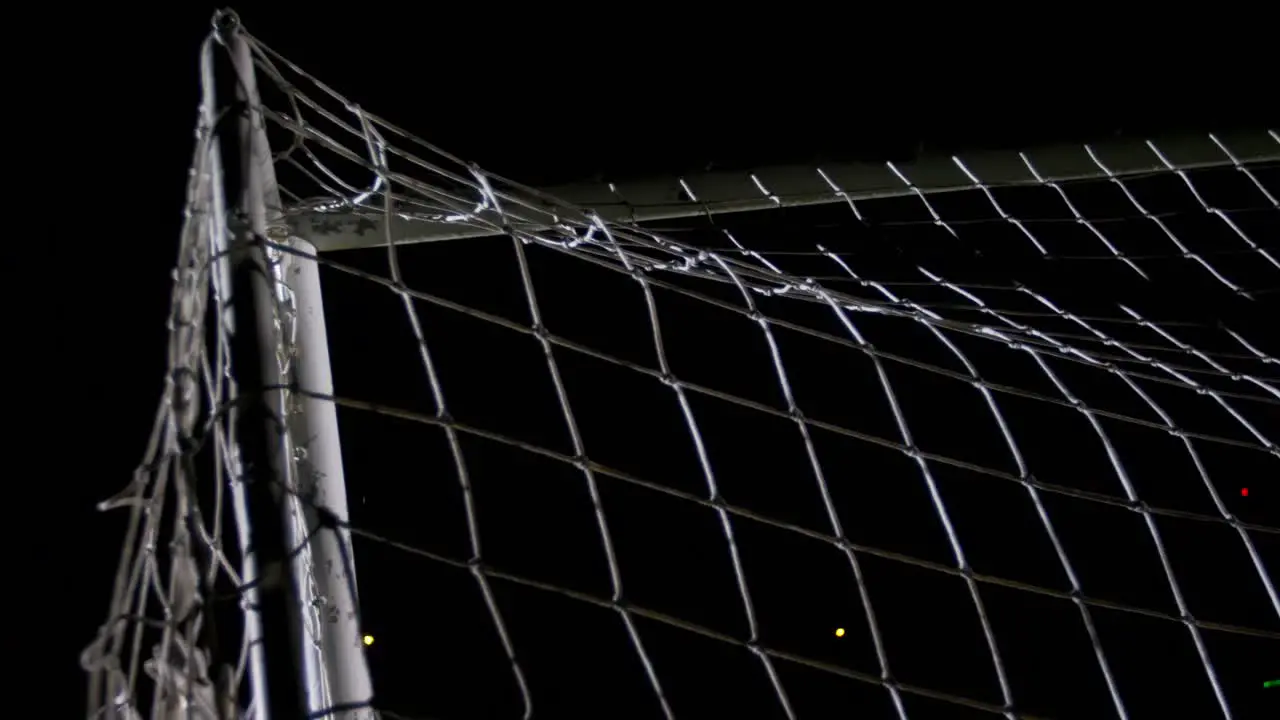 Soccer ball in goal post against goalkeeper 4k