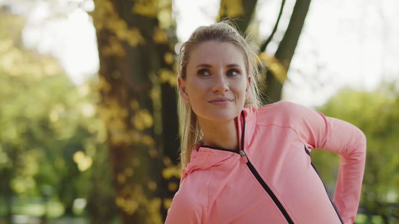 Handheld view of young woman exercising on the fresh air