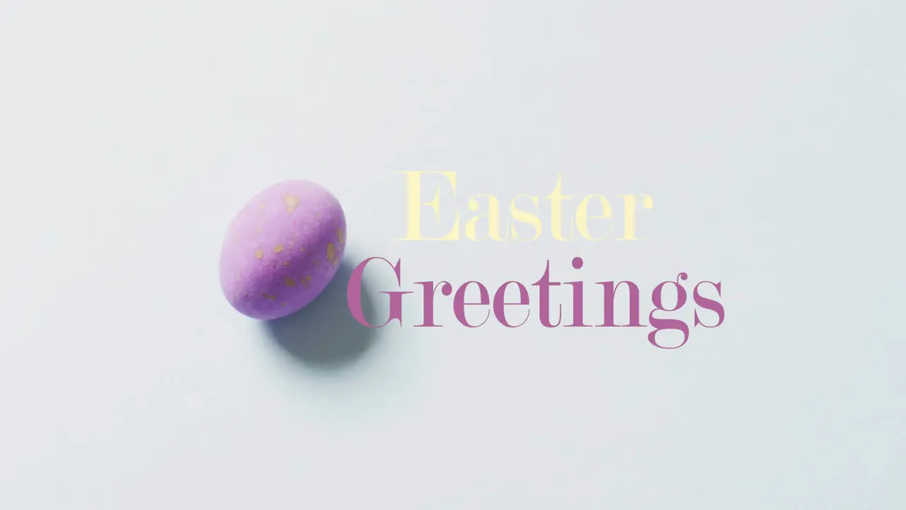 Animation of happy greetings text over purple easter egg on bue background