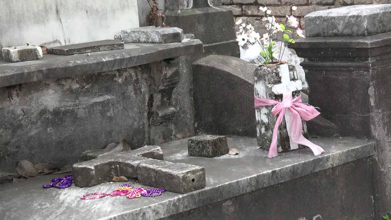 New Orleans beads and flowers by tomb