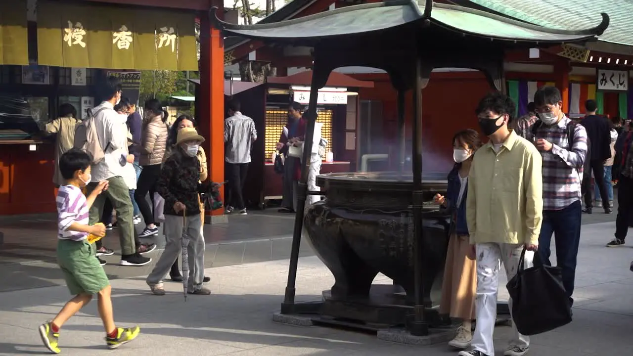 Slow reveal of incense praying well at Senso-ji Shrine in Asakusa