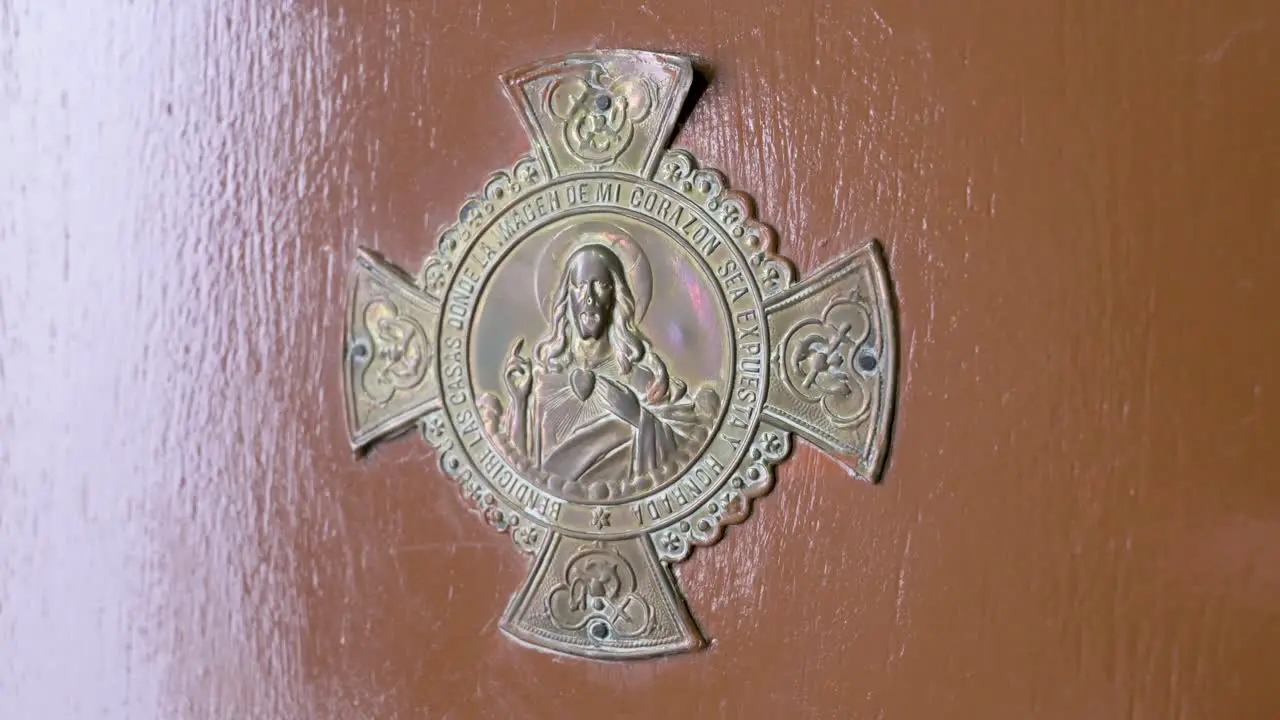 Image of a Jesus Christ decorative door figure is seen at a home's door to welcome guests