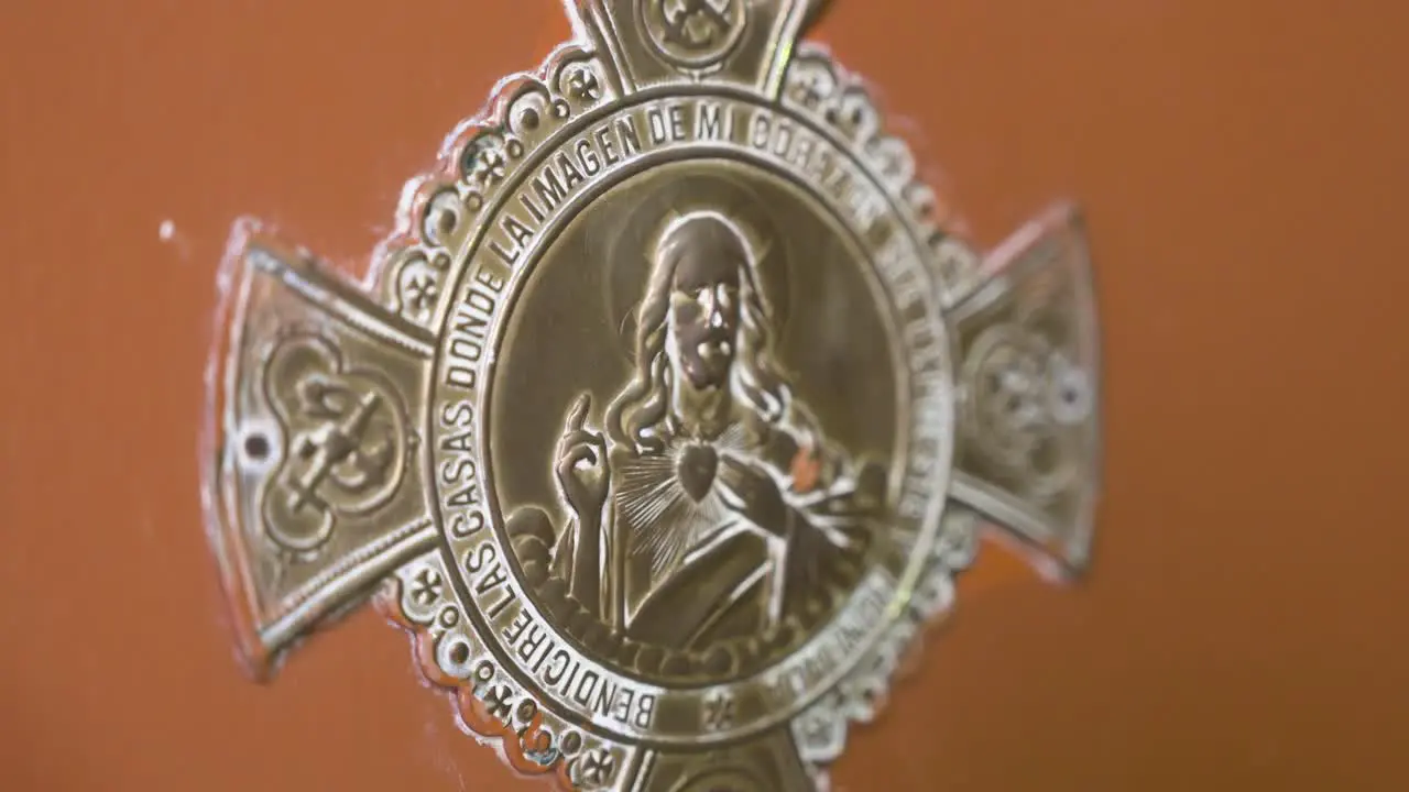 Image of a Jesus Christ insignia decorating a home's door to welcoming guests