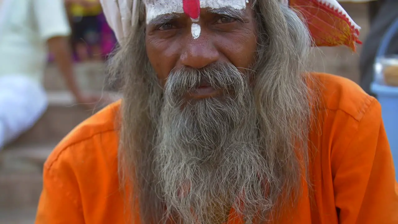 Panning Shot from Sadhus Hands to Face