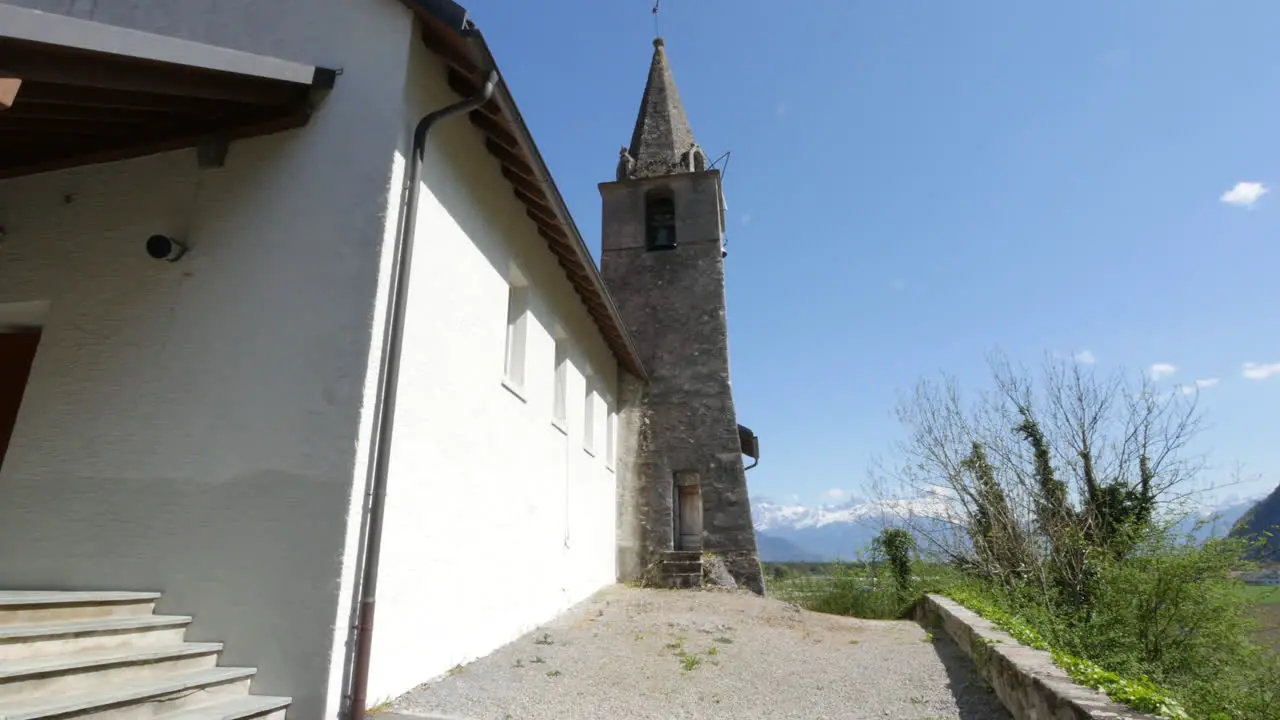 Switzerland Chapel Steeple And Mountains