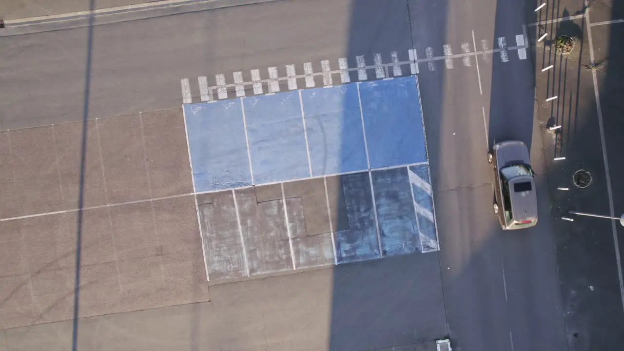 Aerial birdseye rising from parking space demarcations