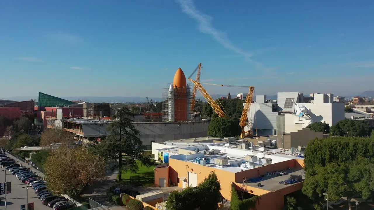 Drone shot rising toward a space rocket at a the California Science Center in LA USA