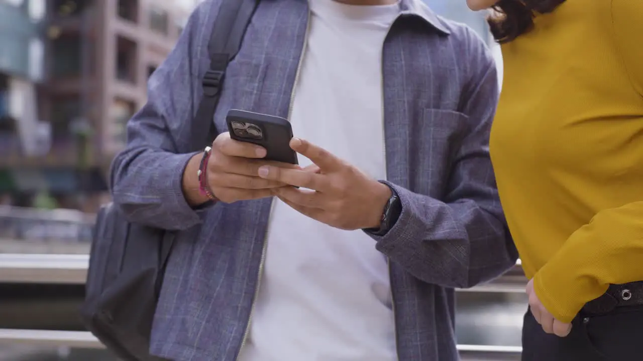 Close Up Shot of Friends Looking at a Smartphone