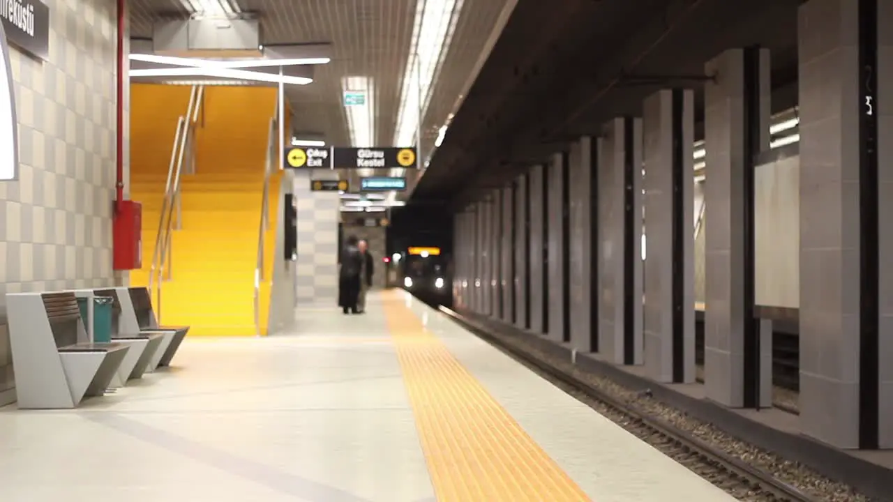 Underground Train Stops At A Platform And Passengers Embark And Disembark