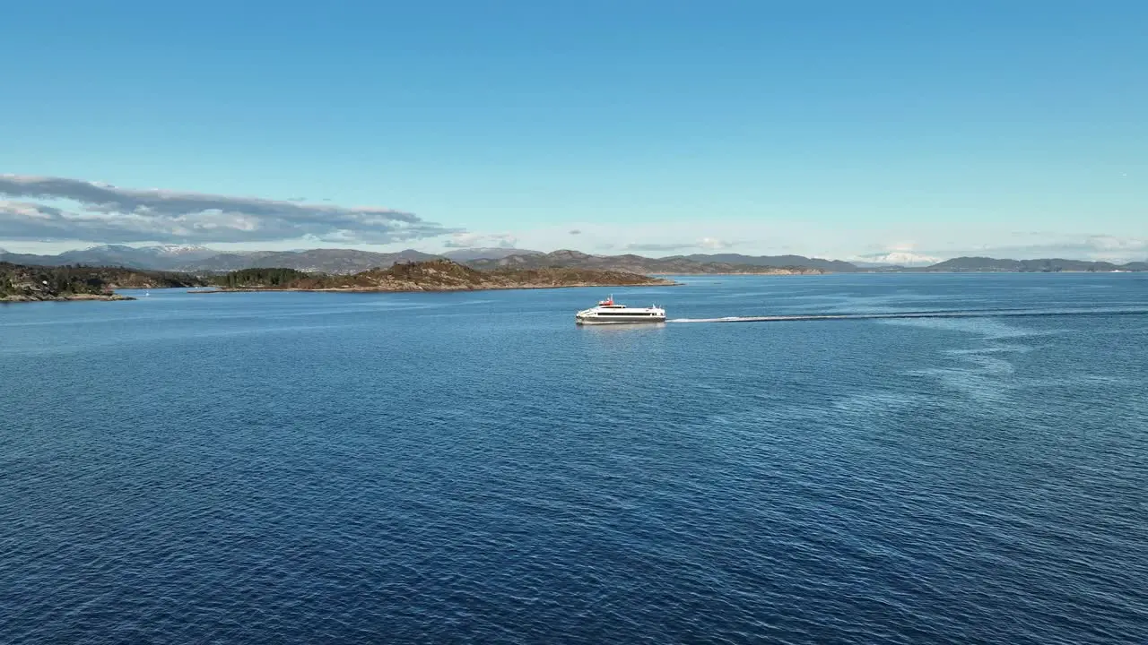 High speed passenger catamaran named Fjordbris from Norled company is crossing leroyosen sea enroute to Bergen Norway Aerial