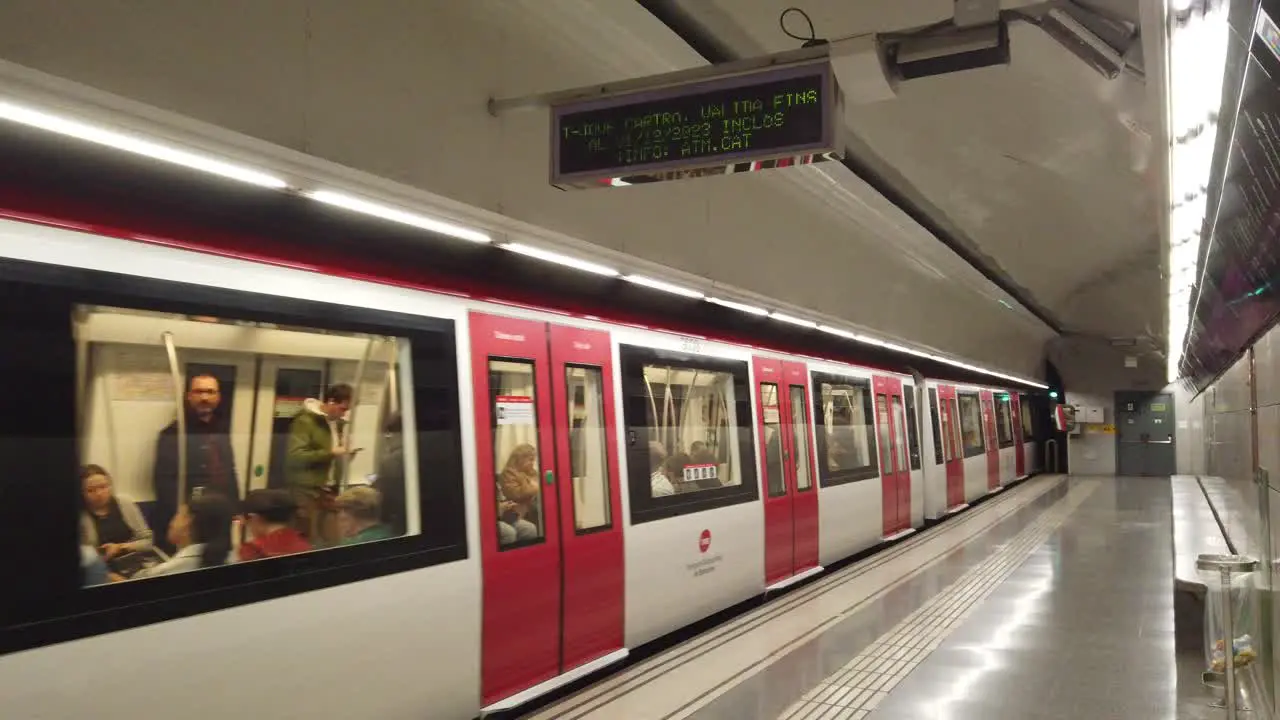 People Travel inside Barcelona Metro Train Departing from Underground Station