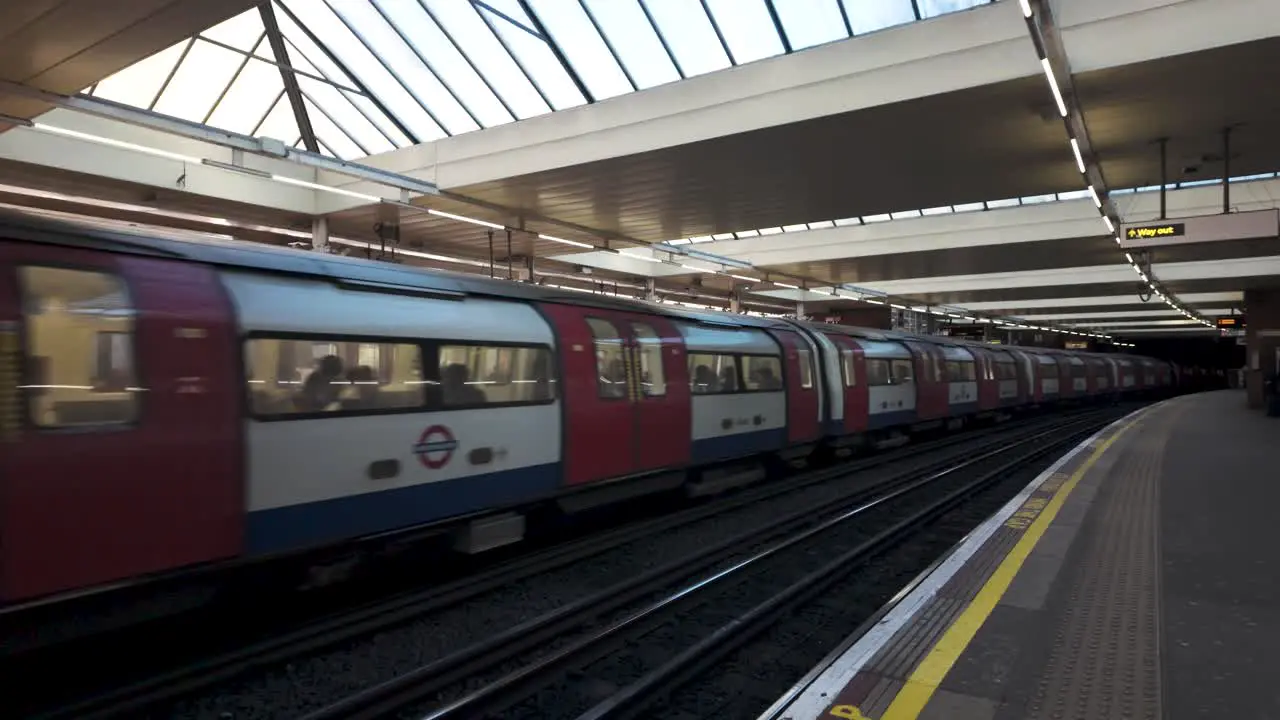 Jubilee line underground tube trains departing from Finchley Road Station platforms