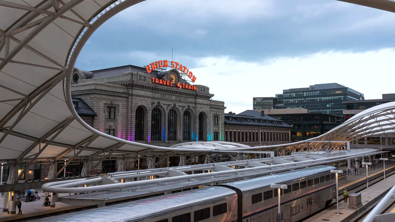 Motion timelapse of trains and people at iconic Union Station in downtown Denver