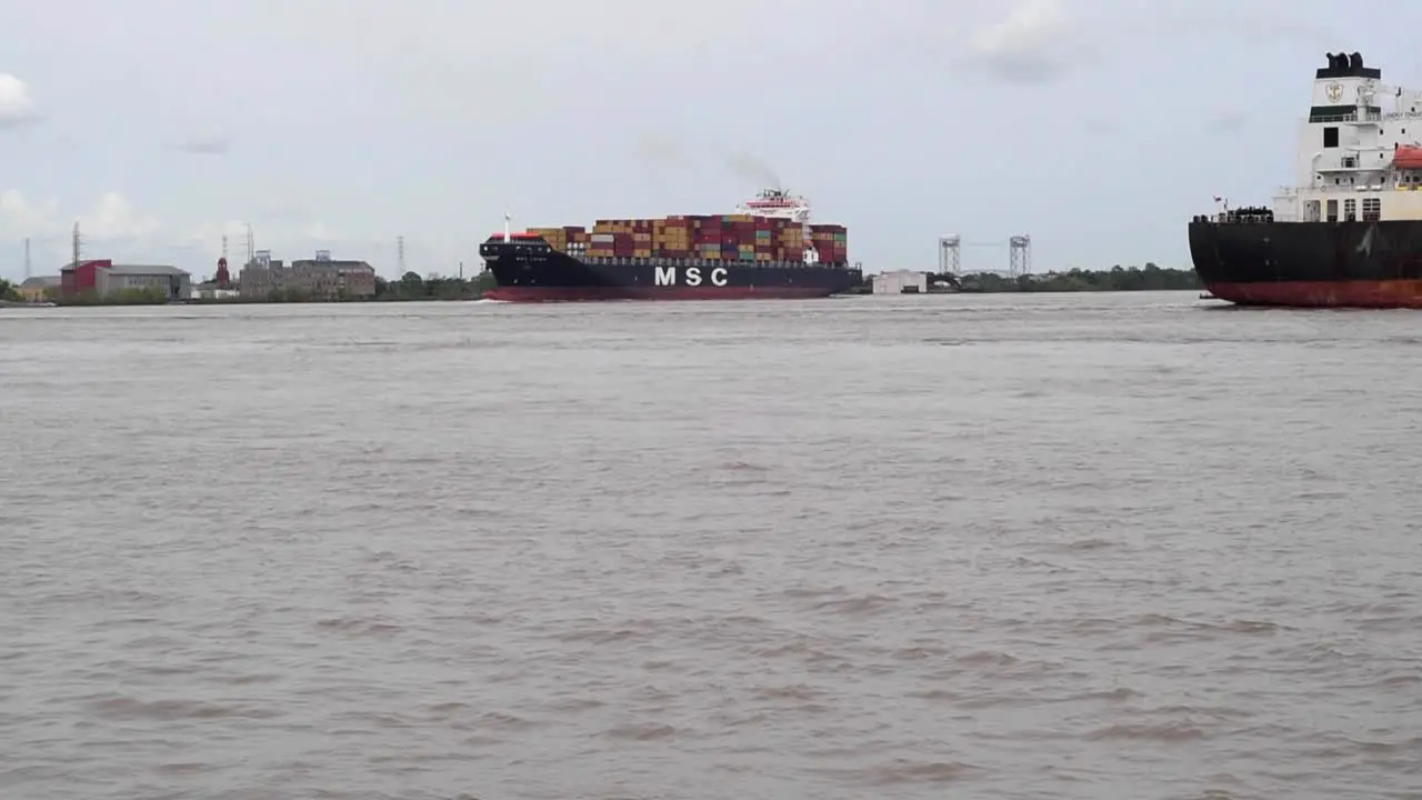 Cargo ships moving down the Mississippi River at New Orleans Lousiana