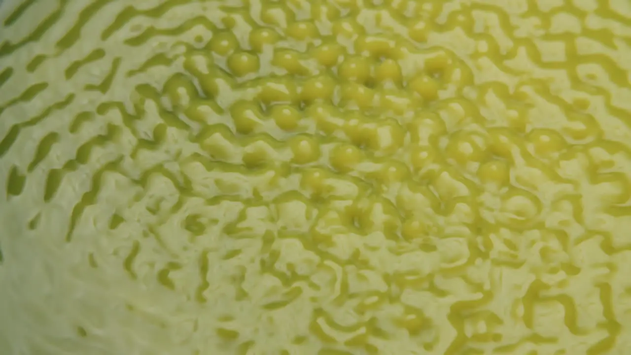 Macro shot of yellow water forming weird shapes and forms