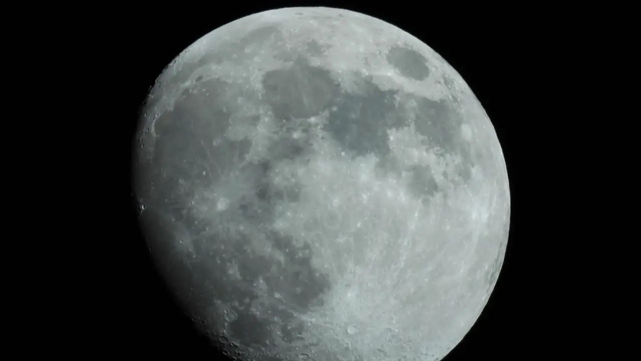 a close-up of the moon with its craters moving in real time