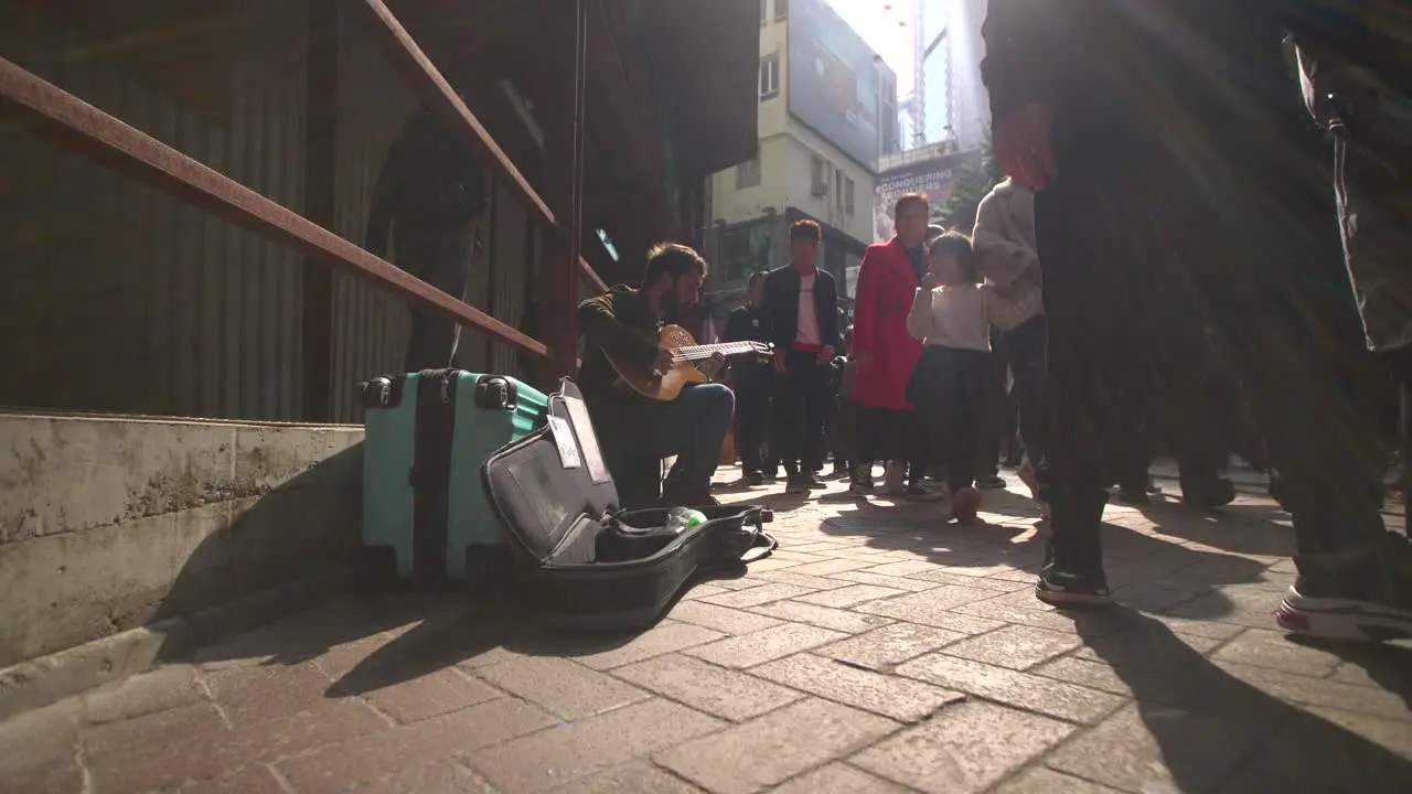 Busker on a Busy Street